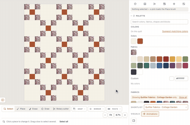In the designer, Shortlist → Choose a shop opens Use a shop; Quiltler Fabrics’ Cottage Garden collection is chosen with Use these fabrics, the Fabrics list shows only its prints, and a pink strawberry print dragged onto an Irish Chain quilt takes every denim square