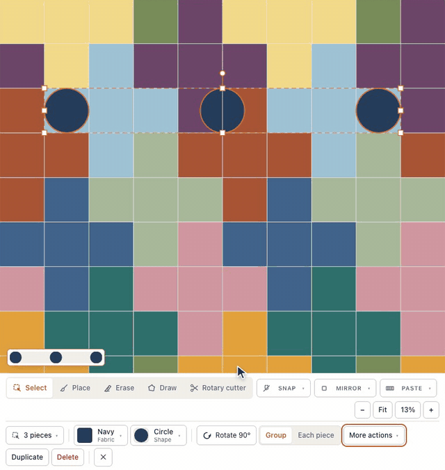 In the designer, three navy circles at odd heights on the Plus Quilt are shift-clicked, More actions → Arrange lines up their top edges, and Space evenly ↔ evens out the gaps between them