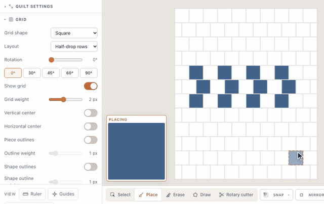 On a blank quilt, Layout set to Half-drop rows slides every other row of spaces over by half a block; with Place, clicking spaces in three rows lays denim squares that stagger like bricks
